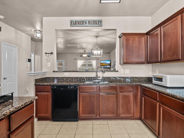 kitchen with black dishwasher, dark stone countertops, and a sink