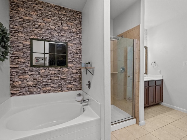 bathroom with a bath, a shower stall, vanity, and tile patterned floors