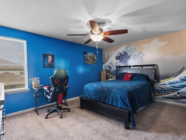 bedroom with ceiling fan, carpet, and baseboards