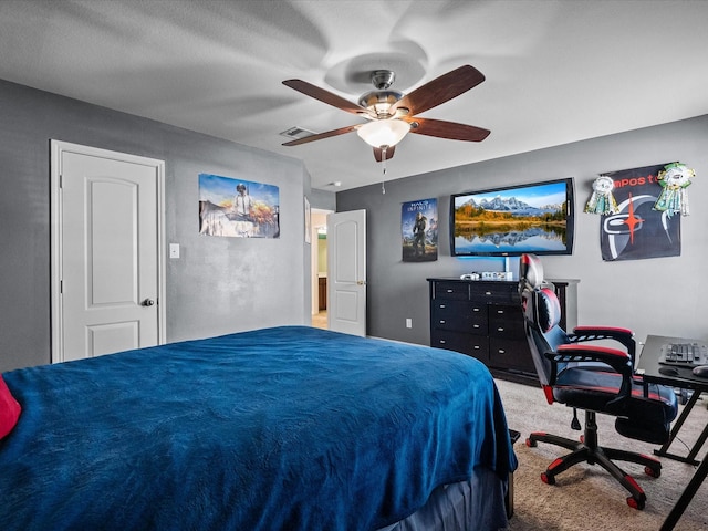 bedroom with visible vents, carpet, and a ceiling fan