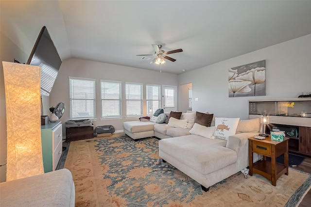 living room with ceiling fan and wood finished floors