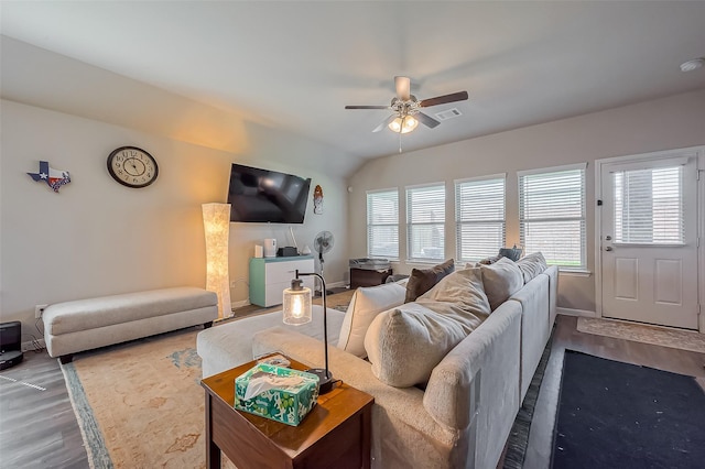 living room featuring visible vents, ceiling fan, baseboards, and wood finished floors