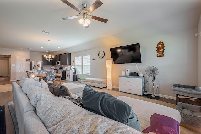 living area with ceiling fan with notable chandelier, recessed lighting, visible vents, and baseboards