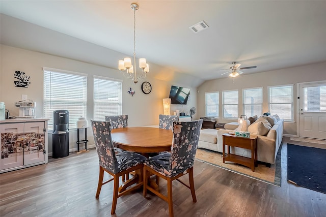 dining area featuring visible vents, baseboards, and wood finished floors