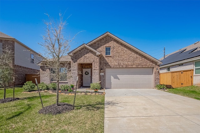 view of front of home featuring a garage, concrete driveway, fence, a front lawn, and brick siding