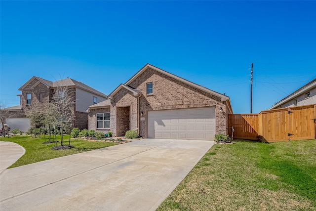 view of front of home with a garage, brick siding, driveway, a gate, and a front lawn