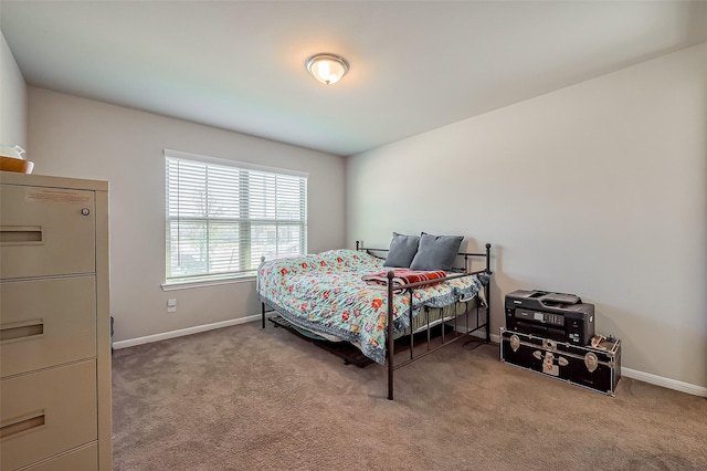 carpeted bedroom with baseboards