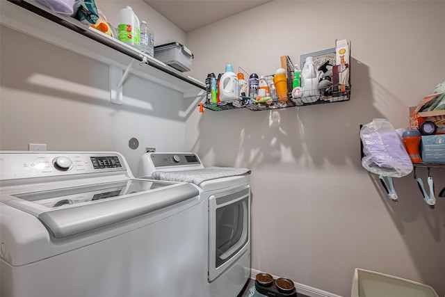 clothes washing area featuring laundry area and independent washer and dryer