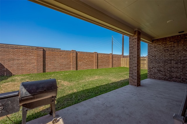 view of patio / terrace with a fenced backyard and area for grilling