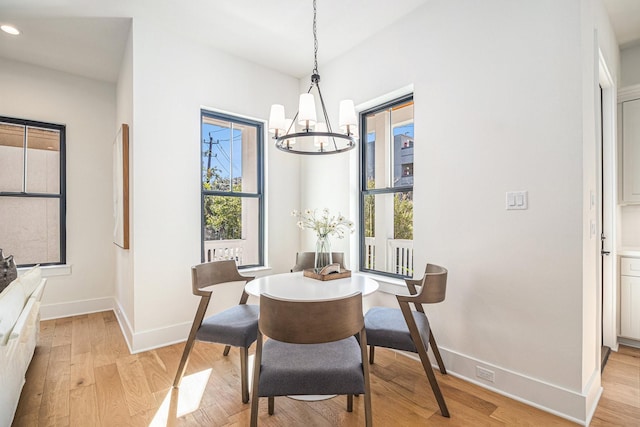 dining room featuring a chandelier, recessed lighting, light wood-style flooring, and baseboards