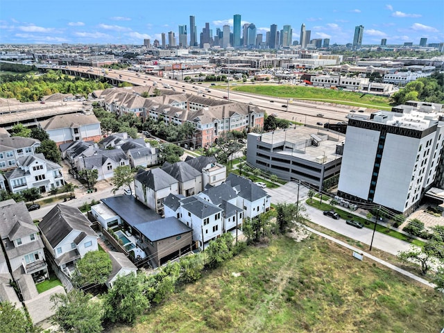 birds eye view of property with a view of city