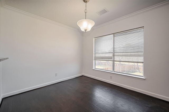 unfurnished room with dark wood-style floors, ornamental molding, visible vents, and baseboards