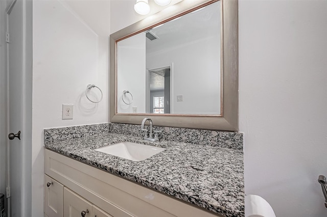 half bath featuring visible vents and vanity