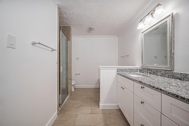 full bathroom featuring toilet, a textured ceiling, a shower stall, vanity, and tile patterned flooring