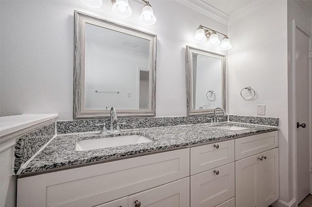 full bath with double vanity, ornamental molding, a sink, and visible vents