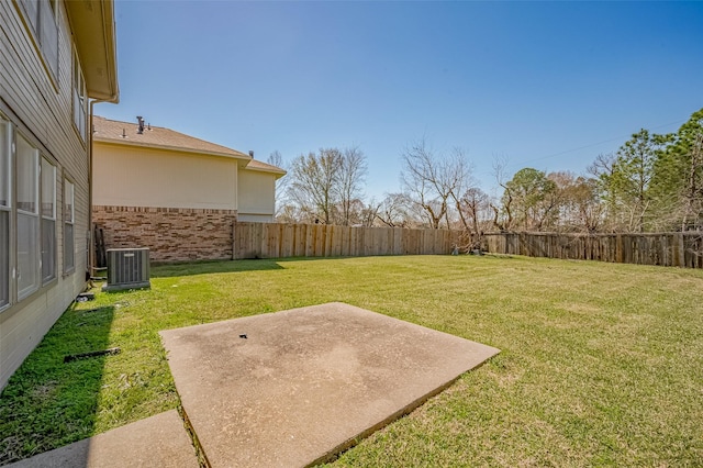 view of yard featuring a fenced backyard, cooling unit, and a patio