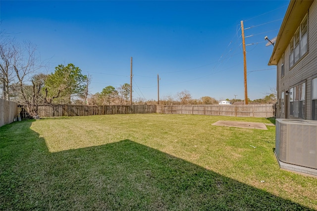 view of yard featuring a fenced backyard and cooling unit