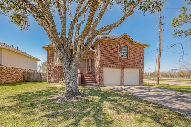 view of front of house with concrete driveway, brick siding, a front lawn, and an attached garage