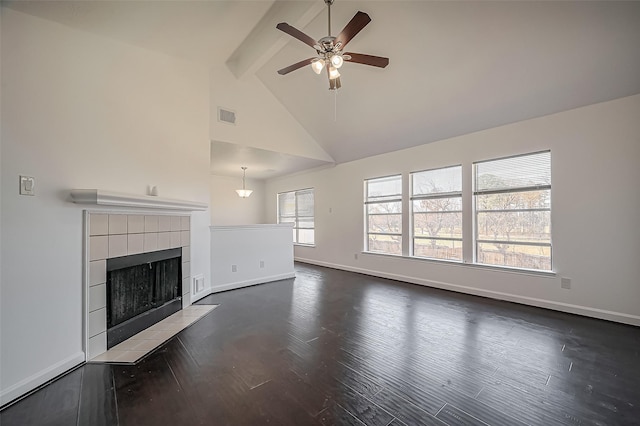 unfurnished living room featuring baseboards, visible vents, dark wood-type flooring, and beam ceiling