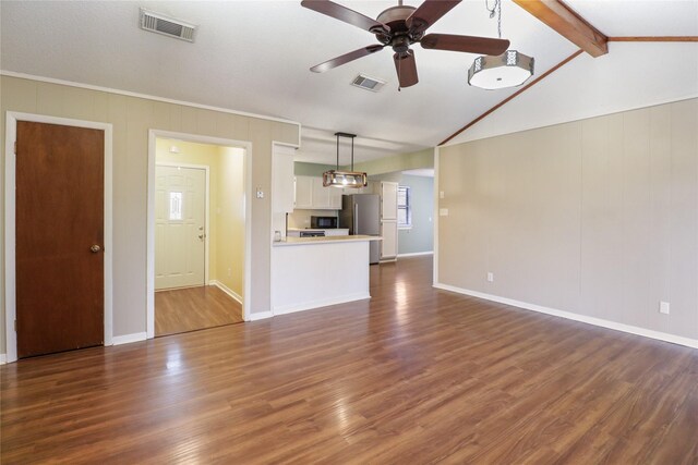 unfurnished living room featuring vaulted ceiling with beams, dark wood-style flooring, visible vents, and a ceiling fan