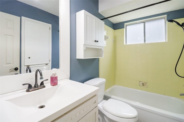 bathroom featuring toilet, tub / shower combination, and vanity