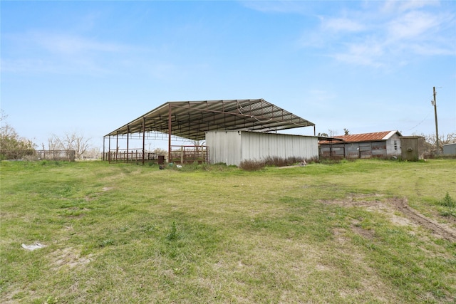 view of yard with an outbuilding and an outdoor structure