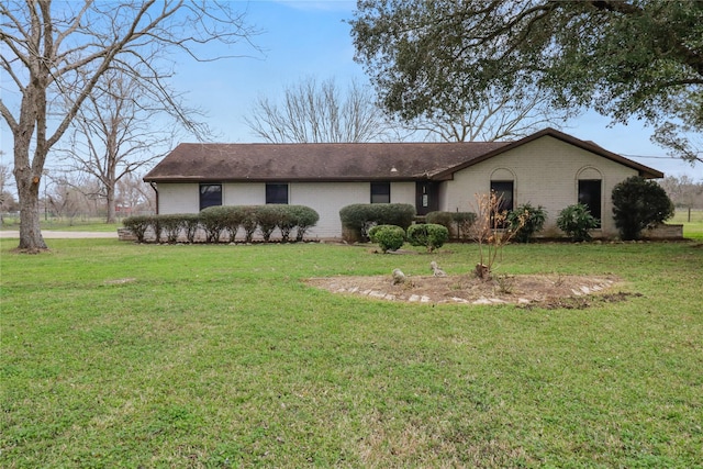 ranch-style house with brick siding and a front lawn