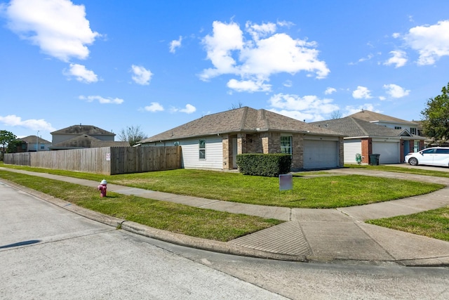 view of front of property with a garage, brick siding, fence, driveway, and a front lawn