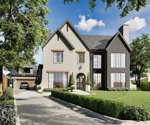 view of front of house with a front lawn, concrete driveway, and a chimney