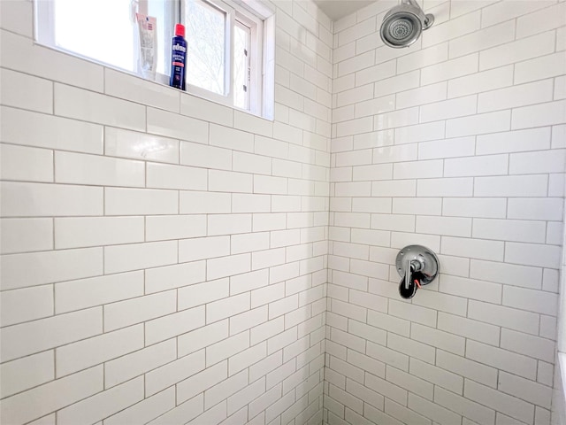 bathroom with tiled shower