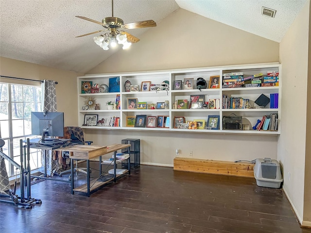 office featuring lofted ceiling, visible vents, a ceiling fan, a textured ceiling, and wood finished floors