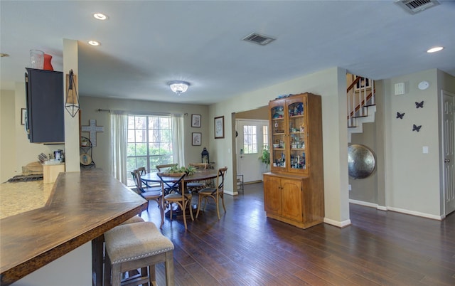 dining room with recessed lighting, visible vents, dark wood finished floors, and baseboards