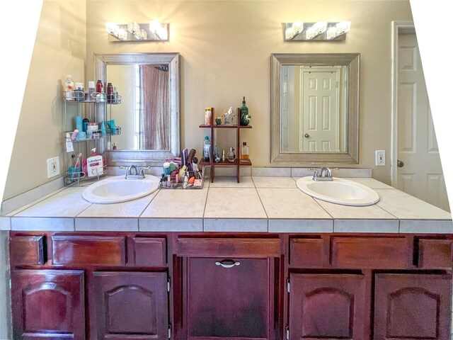 bathroom featuring double vanity and a sink