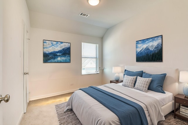 carpeted bedroom with lofted ceiling, visible vents, and baseboards