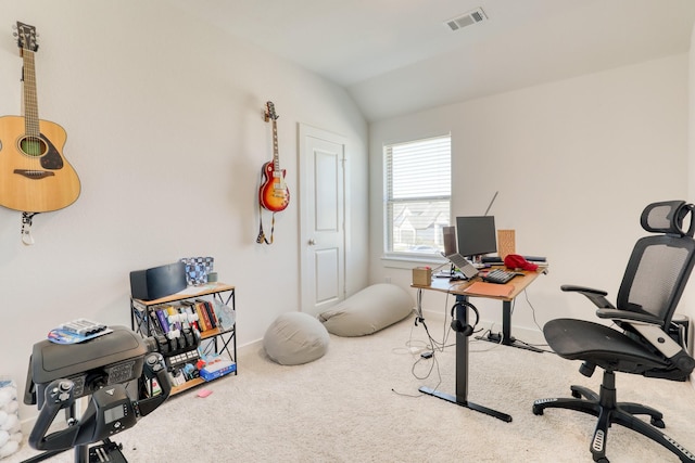 home office featuring carpet floors, baseboards, visible vents, and vaulted ceiling