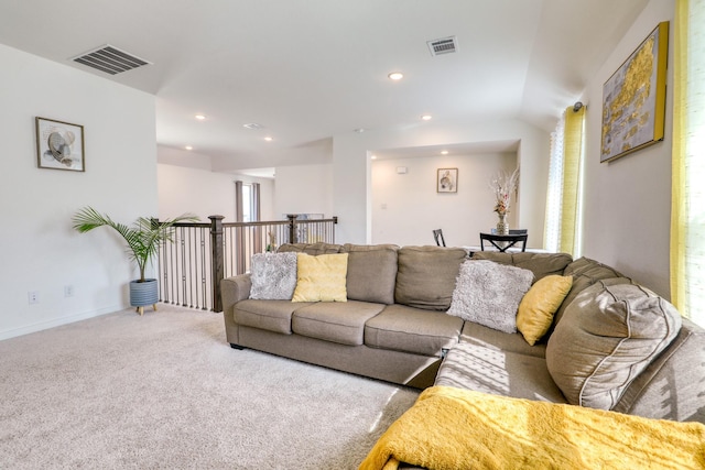 carpeted living area with baseboards, visible vents, and recessed lighting