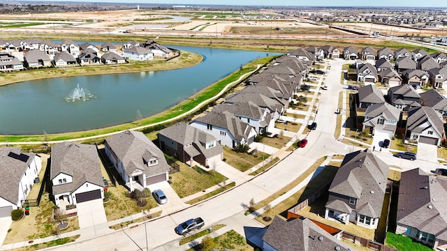 aerial view featuring a water view and a residential view