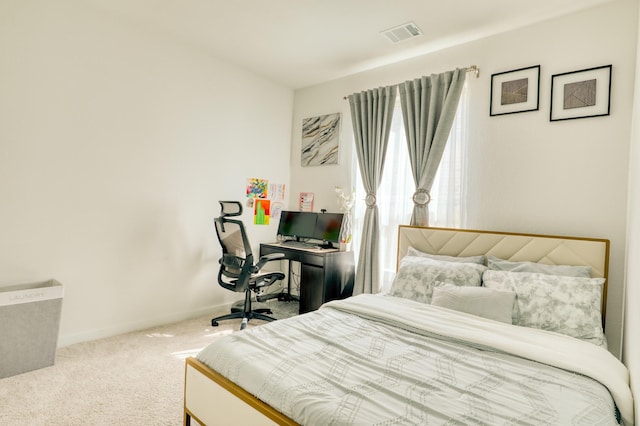 bedroom featuring carpet floors, visible vents, and baseboards