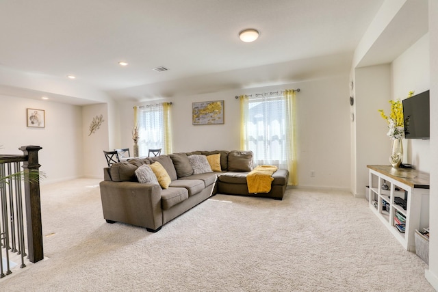 living area featuring baseboards, carpet flooring, and recessed lighting