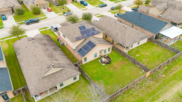 birds eye view of property with a residential view