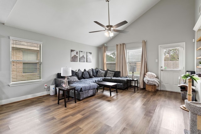 living room with high vaulted ceiling, wood finished floors, a ceiling fan, and baseboards