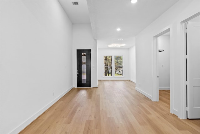 entrance foyer featuring light wood finished floors, visible vents, baseboards, and recessed lighting