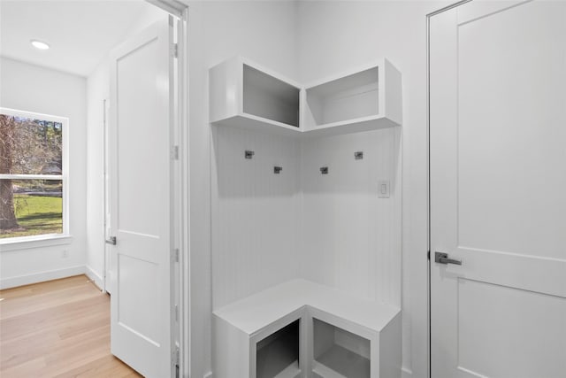 mudroom featuring recessed lighting, light wood-style flooring, and baseboards