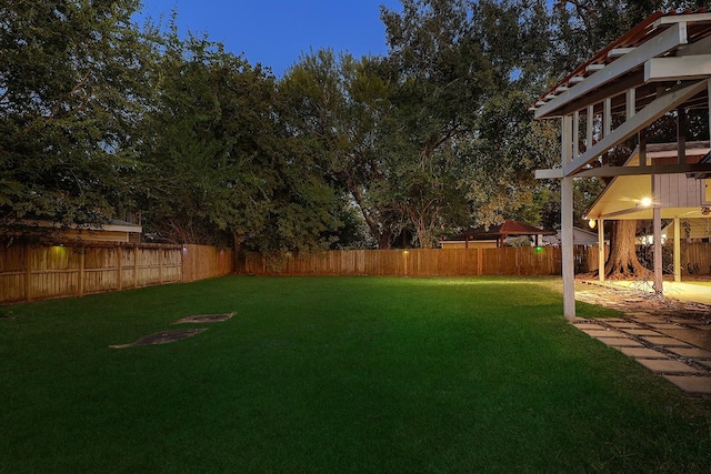 view of yard with a fenced backyard