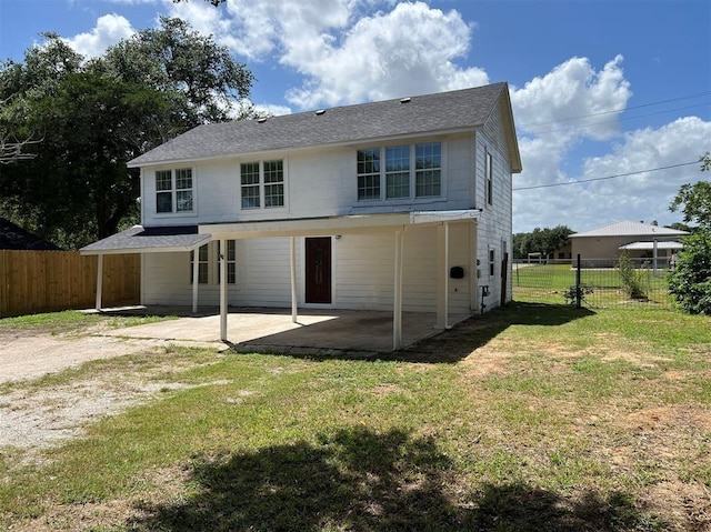 back of property featuring a patio area, fence, and a lawn