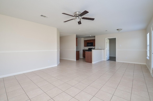 26810 Blacktail Ct, Hockley, TX 77447 - empty room with light tile patterned floors, a ceiling fan, visible vents, and baseboards