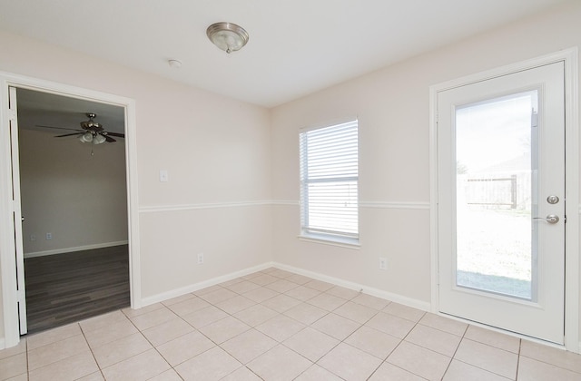 26810 Blacktail Ct, Hockley, TX 77447 - spare room with light tile patterned floors, a ceiling fan, and baseboards