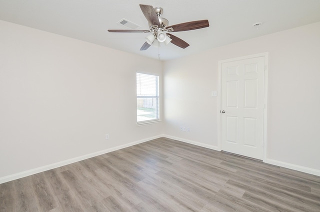 26810 Blacktail Ct, Hockley, TX 77447 - spare room featuring visible vents, a ceiling fan, baseboards, and wood finished floors