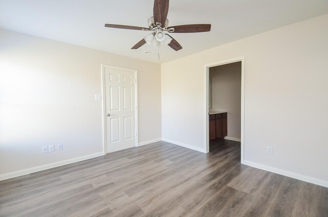 26810 Blacktail Ct, Hockley, TX 77447 - empty room with baseboards, wood finished floors, and a ceiling fan
