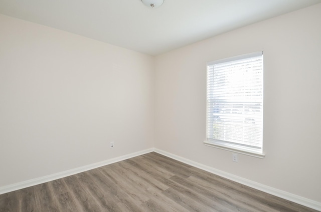 26810 Blacktail Ct, Hockley, TX 77447 - unfurnished room featuring baseboards and wood finished floors